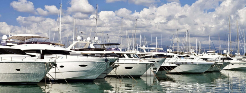 Row of luxury yachts mooring in a harbour